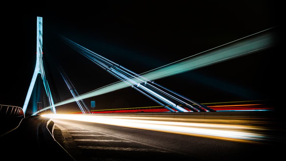 Night Bridge Light Trails by Jörg Vollrath — canvas wall art