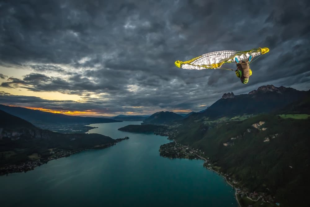 Wingsuit Over Mountain Lake by Tristan Shu — canvas wall art