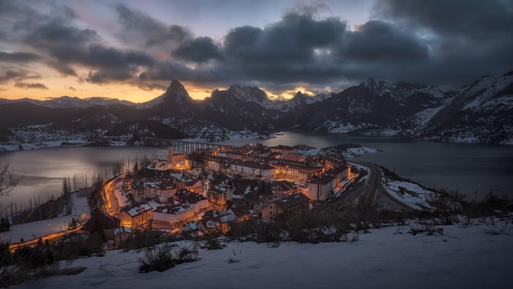 Snowy Mountain Village Lights by Juan Romero Salamanca — canvas wall art