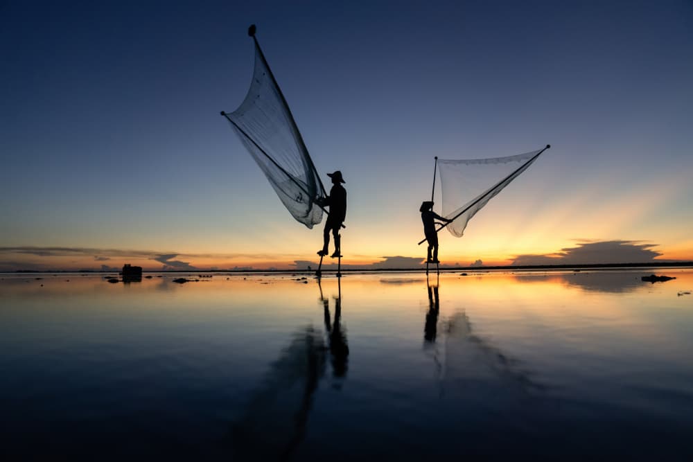 Stilt Fishermen Sunrise by Sarawut Intarob — canvas wall art