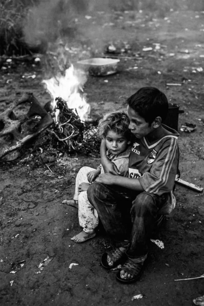 Children By The Fire by Sorin Vidis — canvas wall art