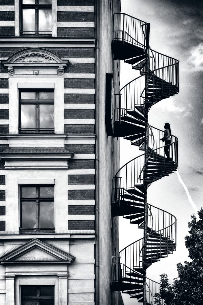Woman on Spiral Staircase by Donato Bellomo — canvas wall art