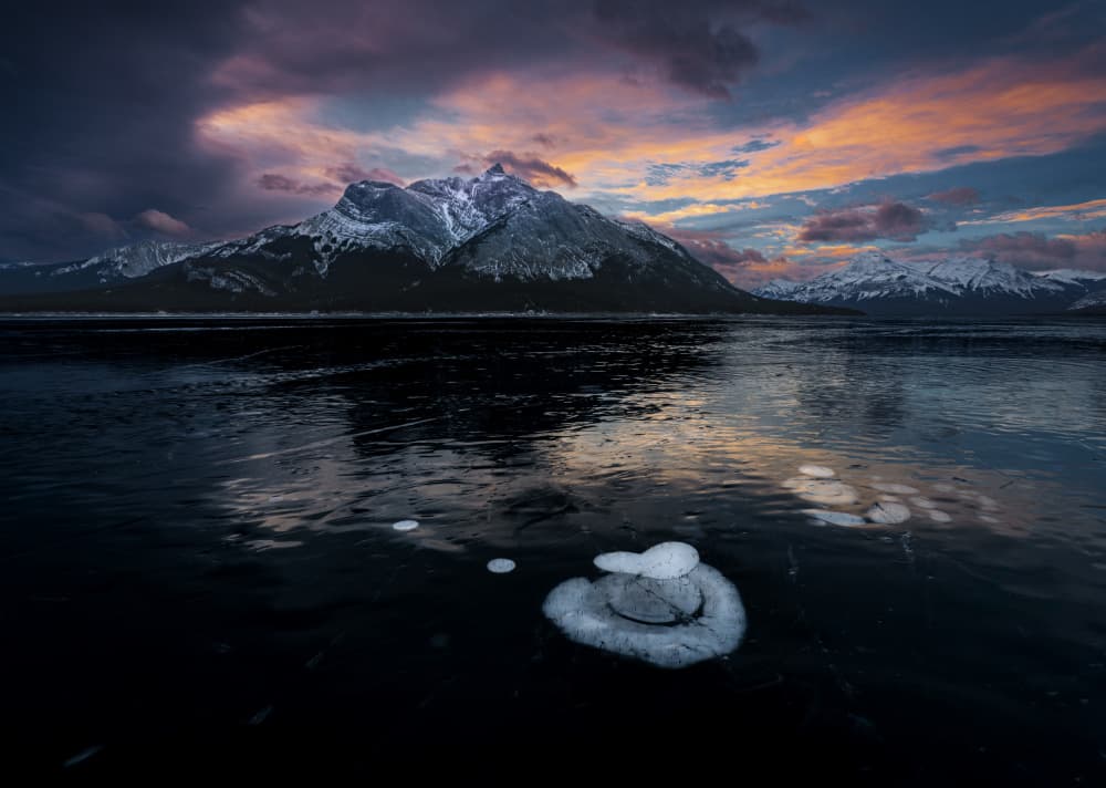Dramatic Frozen Mountain Sunset by Bing Li — canvas wall art