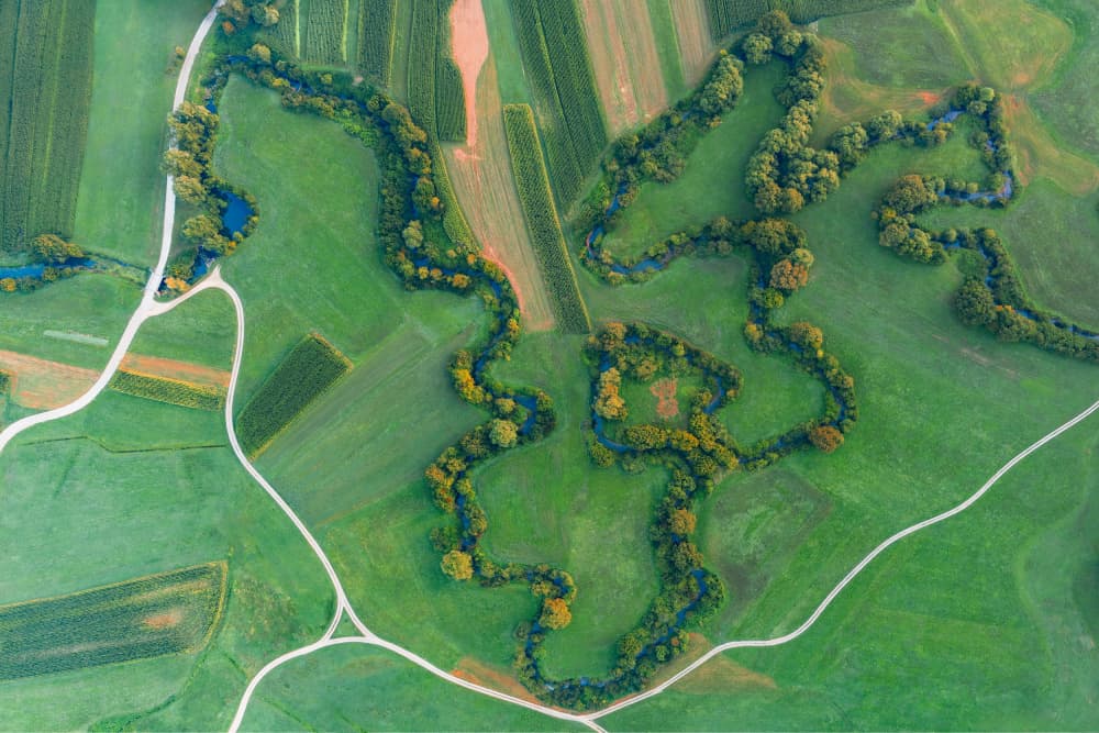 Winding River Green Fields by Jure Kravanja — canvas wall art