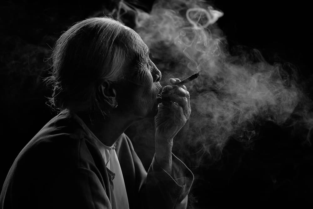 Contemplative Smoke Portrait by Vichaya — canvas wall art