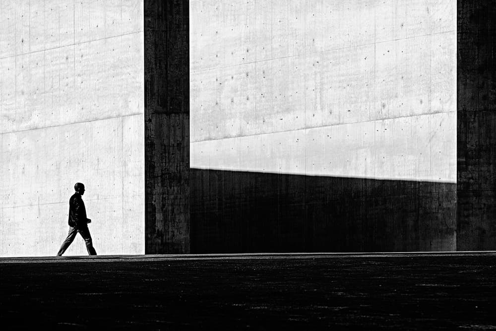 Man Walking Concrete Shadows by Carlos Costa — canvas wall art