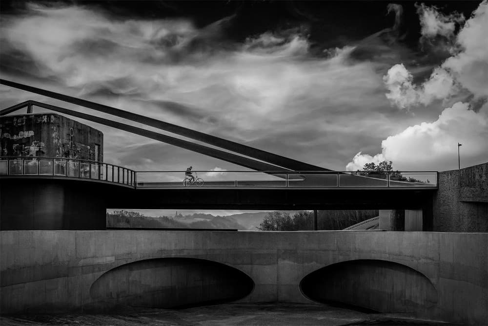 Cyclist on Modern Bridge by Gerard Valckx — canvas wall art