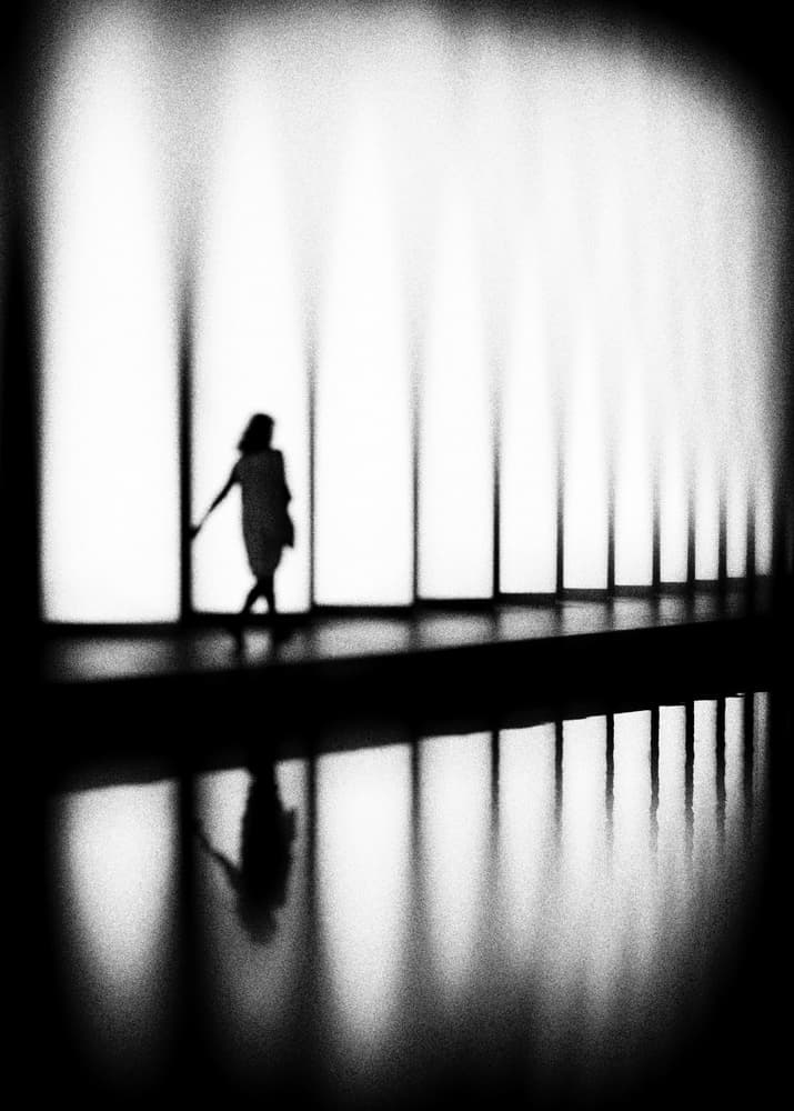 Woman In Light Corridor by Eric Drigny — canvas wall art