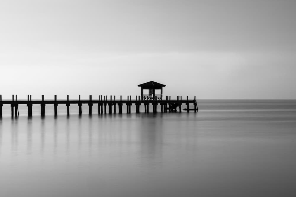Serene Wooden Pier by Hasan Shaboot — canvas wall art