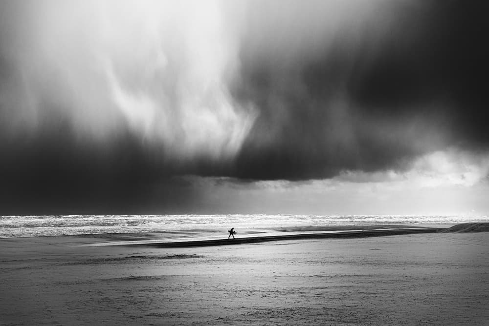 Lone Surfer Stormy Sky by Alexander Jikharev — canvas wall art