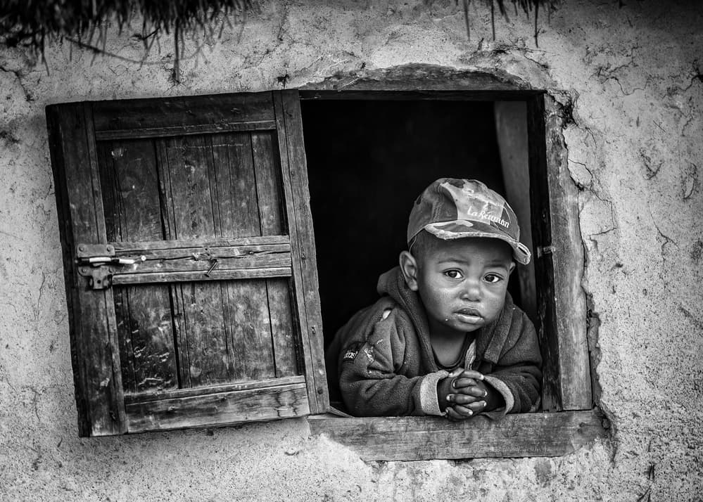 Child at Rustic Window by Marco Tagliarino — canvas wall art