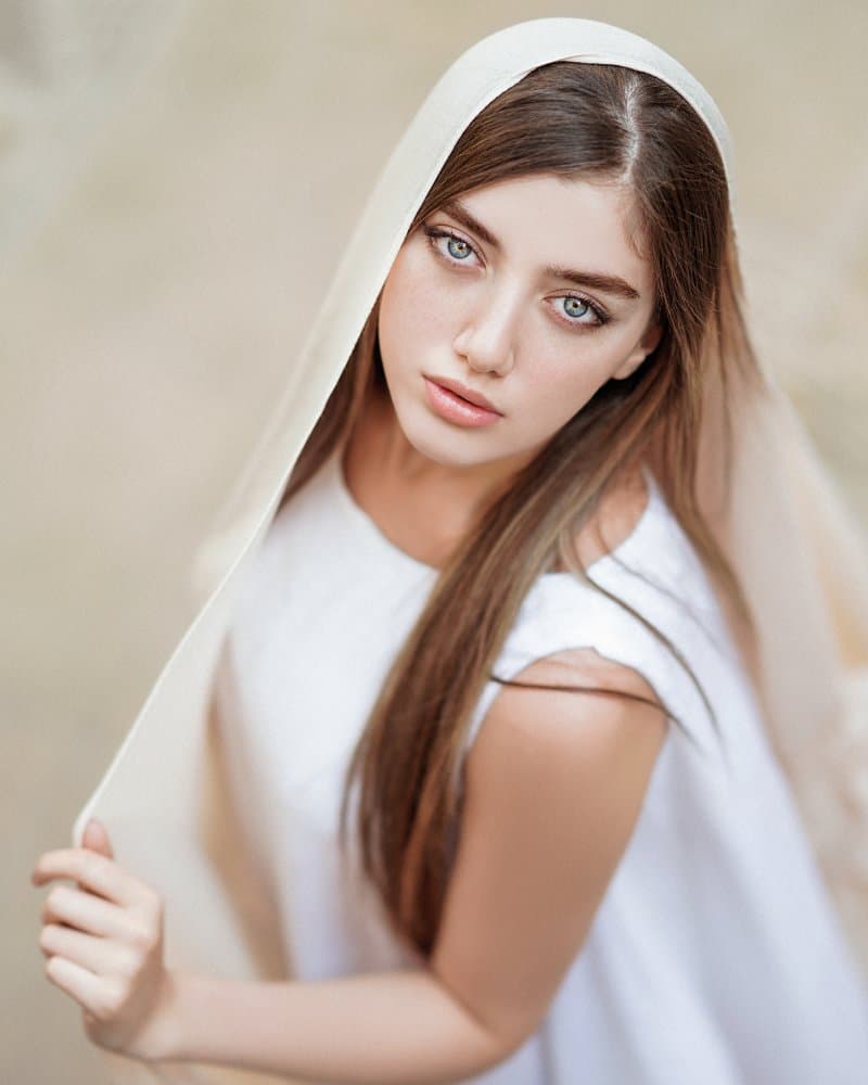 Serene Blue Eyed Woman by Behrouz Sasani — canvas wall art