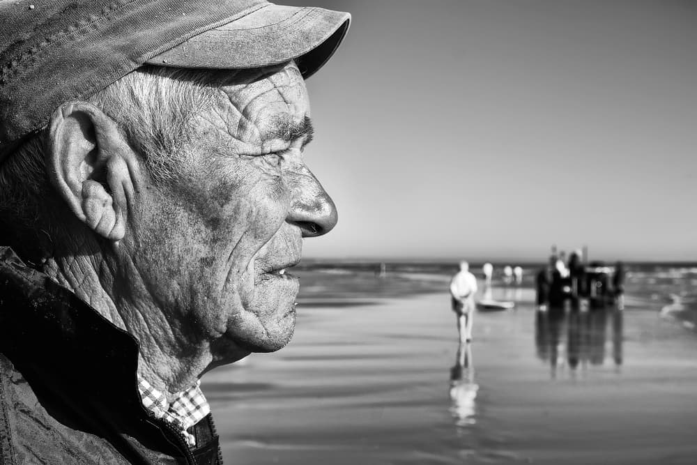 Elderly Man Beach Walk by Josefina Melo — canvas wall art