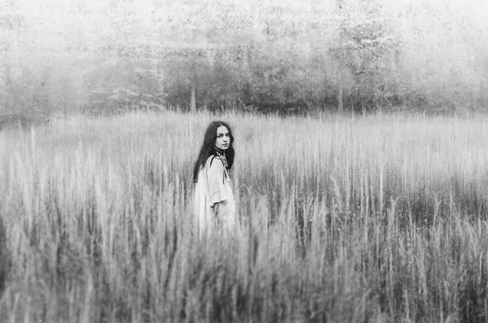 Pensive Woman Tall Grass by Desislava Ignatova — canvas wall art