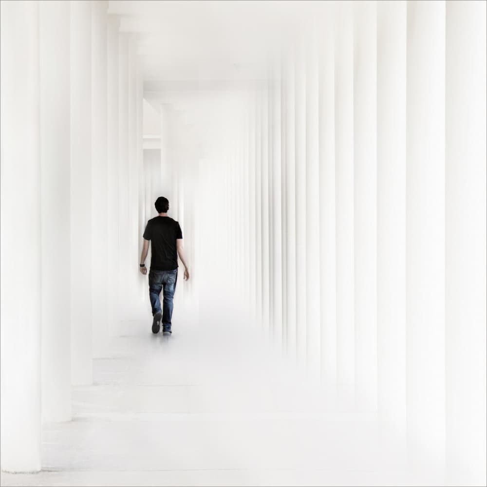 Man Walking White Hallway by Gilbert Claes — canvas wall art