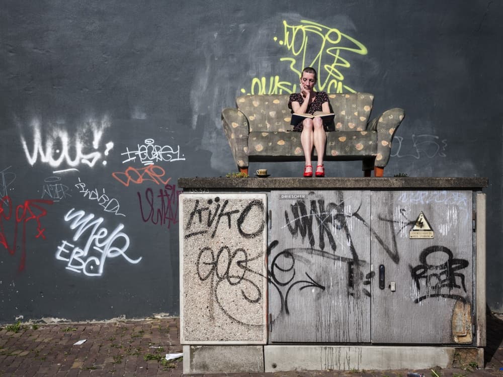 Woman on Urban Couch by Ton Dirven — canvas wall art