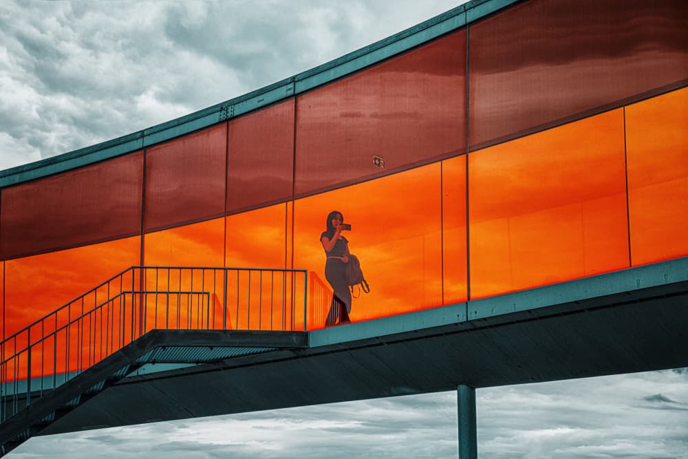 Silhouette in Orange Walkway by Louie Luo — canvas wall art