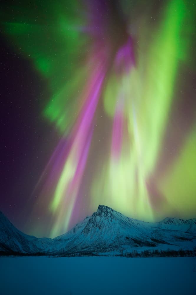 Aurora Over Winter Mountains by David Martin Castan — canvas wall art