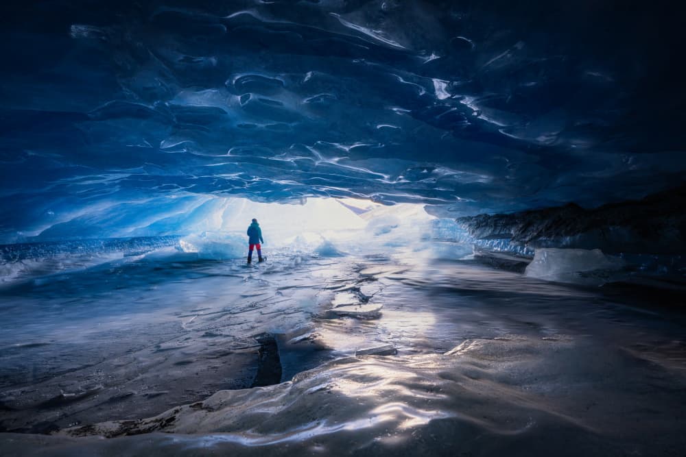 Blue Ice Cave Explorer by Yongnan Li (李永男) — canvas wall art