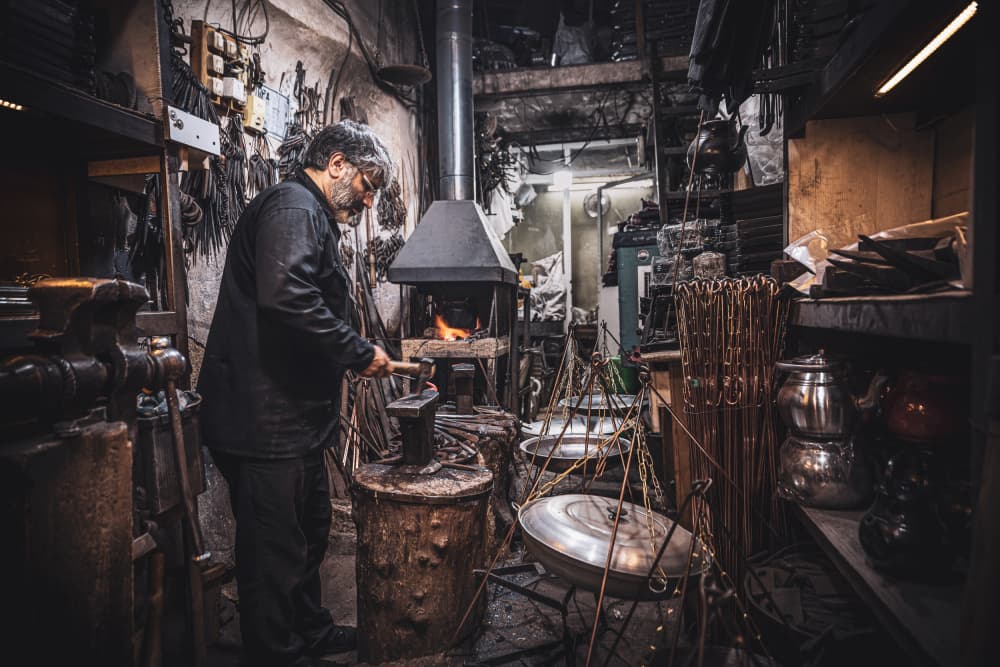 Artisan at the Forge by Marco Tagliarino — canvas wall art