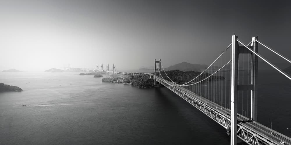 Coastal Suspension Bridge by Akira TAKAUE — canvas wall art