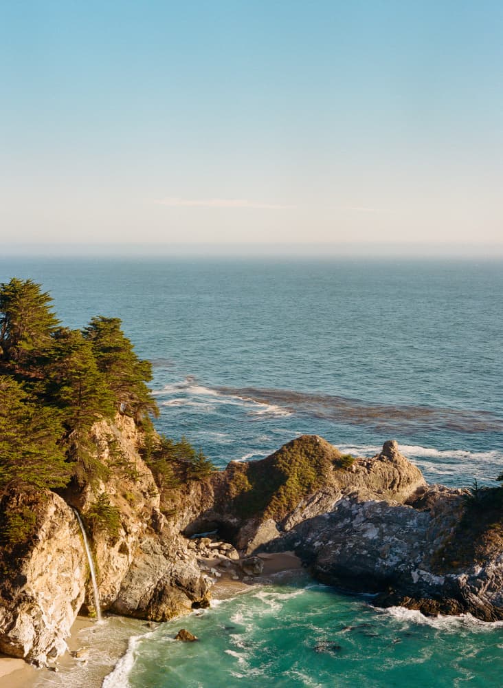 Cliffside Ocean Waterfall by Bethany Young — canvas wall art
