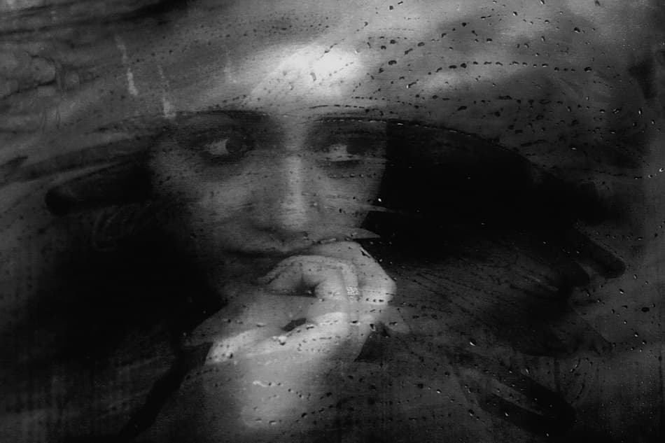 Pensive Woman Through Rain by Ummu Nisan Kandilcioglu — canvas wall art