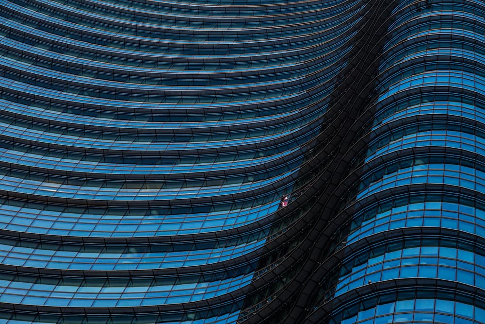 Curved Blue Glass Facade by Marco Tagliarino — canvas wall art