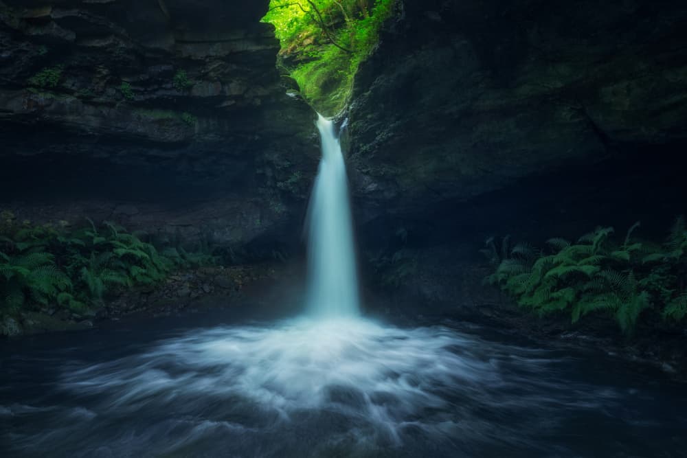 Serene Cave Waterfall by David Martin Castan — canvas wall art