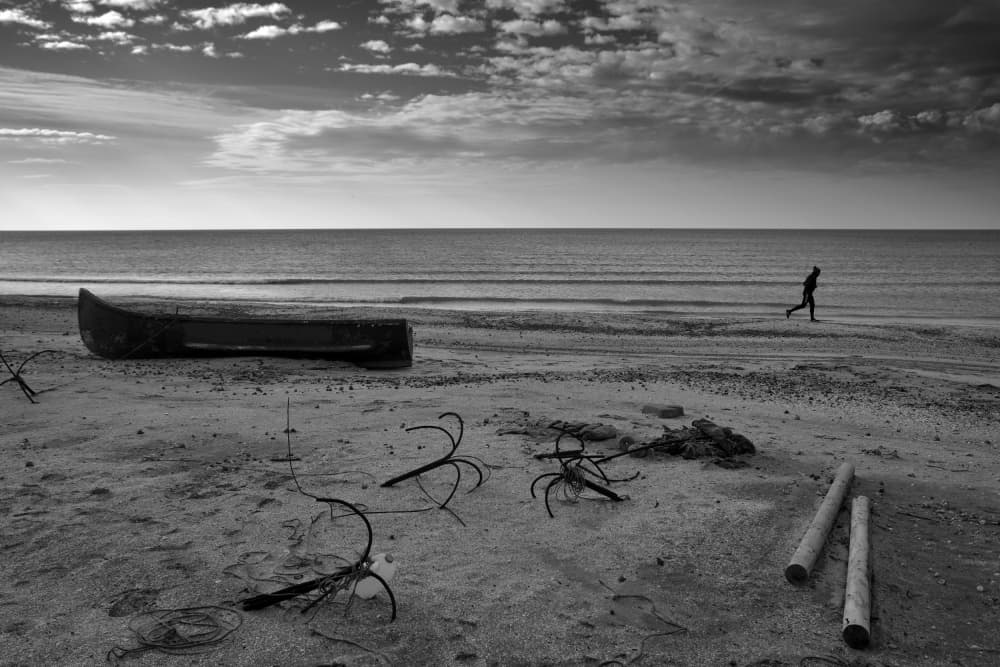 Lone Runner Beach by Emilian Avramescu — canvas wall art