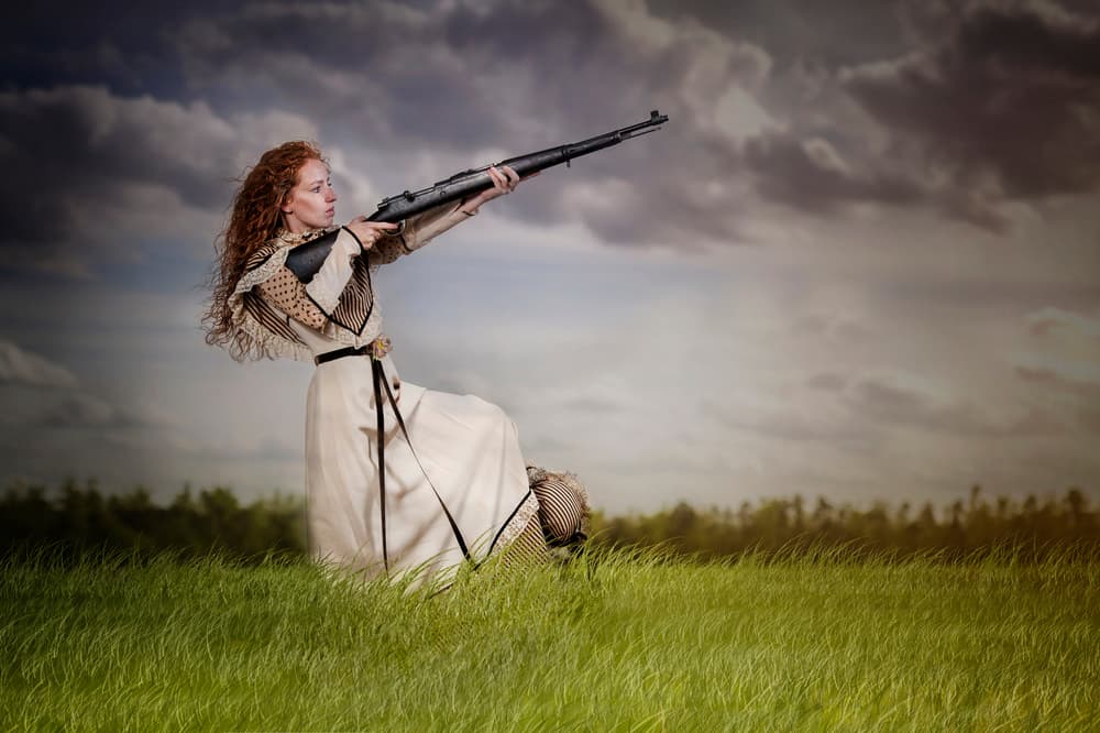 Pioneer Woman Aiming Rifle by Monika Vanhercke — canvas wall art