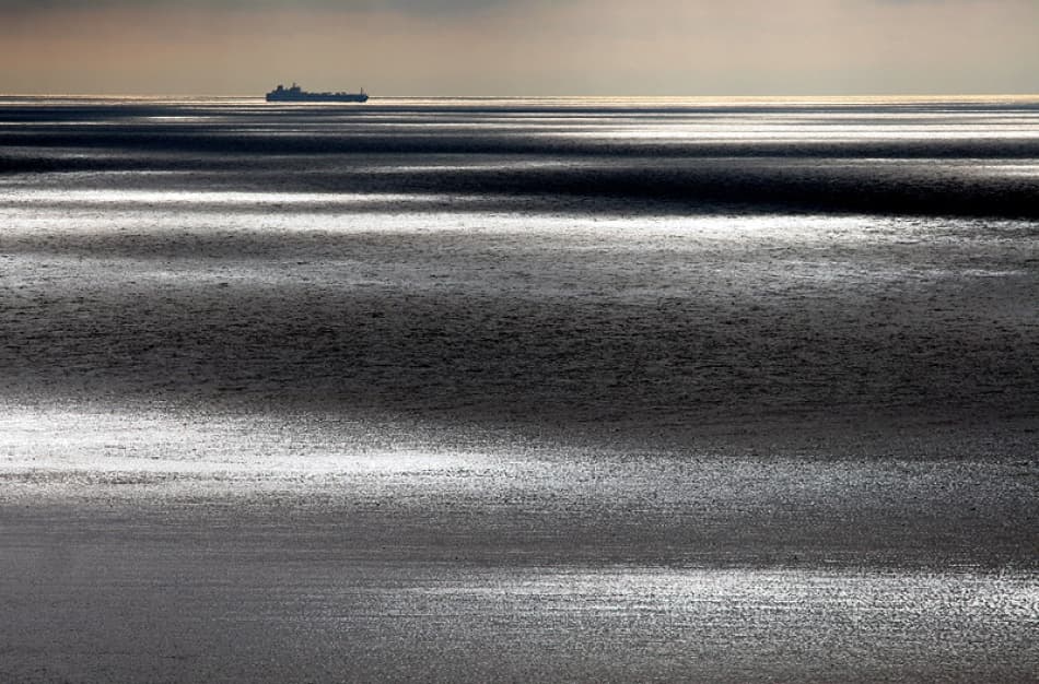 Distant Ship Shimmering Ocean by Bror Johansson — canvas wall art