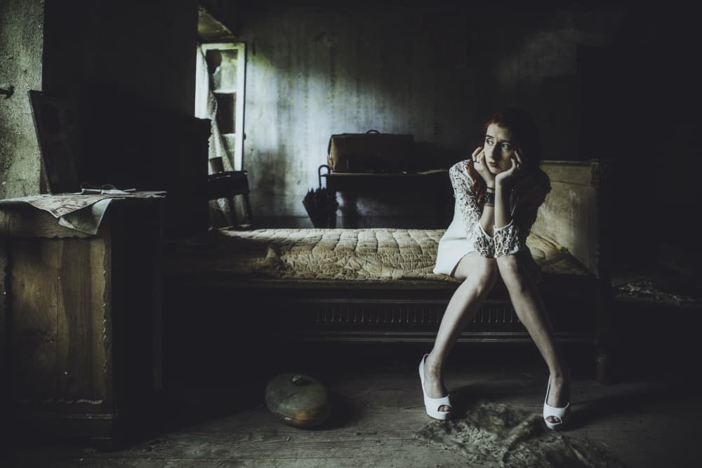 Pensive Woman Dark Room by Georgios Bero — canvas wall art