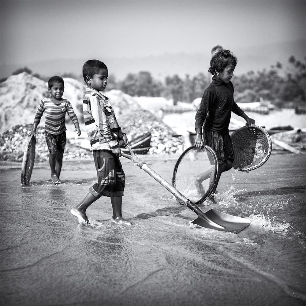 Children Sifting Sand by Marcel Rebro — canvas wall art
