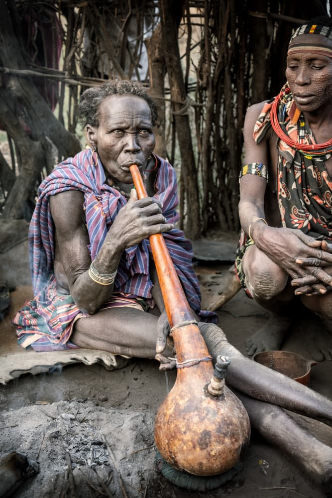 Tribal Elder Smoking Pipe by Trevor Cole — canvas wall art