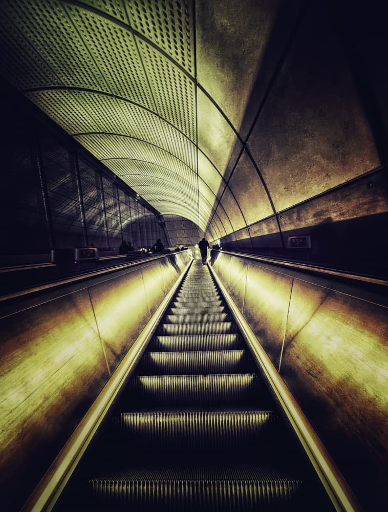 Long Subway Escalator by Paul — canvas wall art