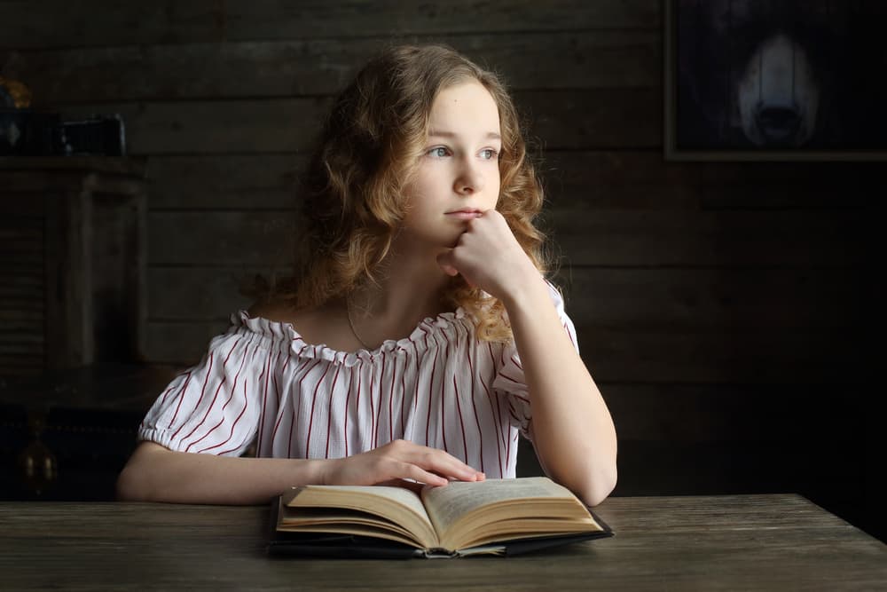 Thoughtful Girl Reading by Victoria Glinka — canvas wall art