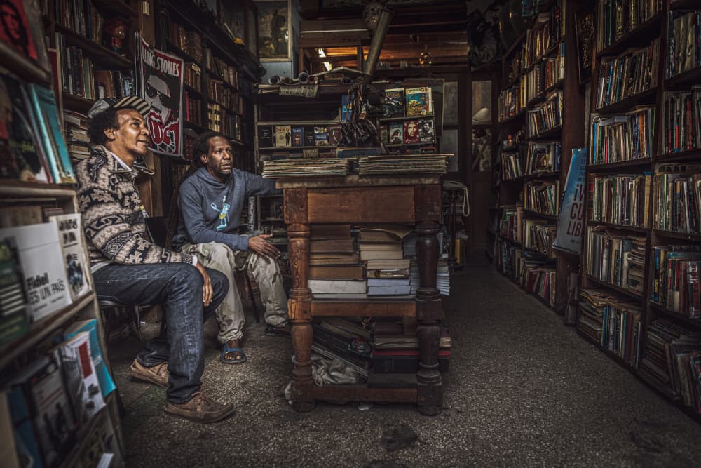 Quiet Bookstore Scene by Marco Tagliarino — canvas wall art