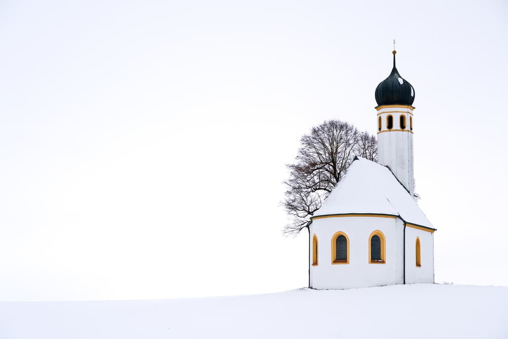 Snowy Winter Church by Hans Peter Rank — canvas wall art