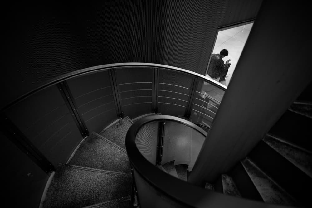 Solitary Figure Spiral Stairs by Satoshi Hata — canvas wall art
