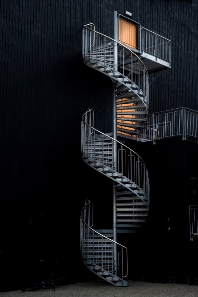 Black and Orange Spiral Staircase by Jiahong Zeng — canvas wall art