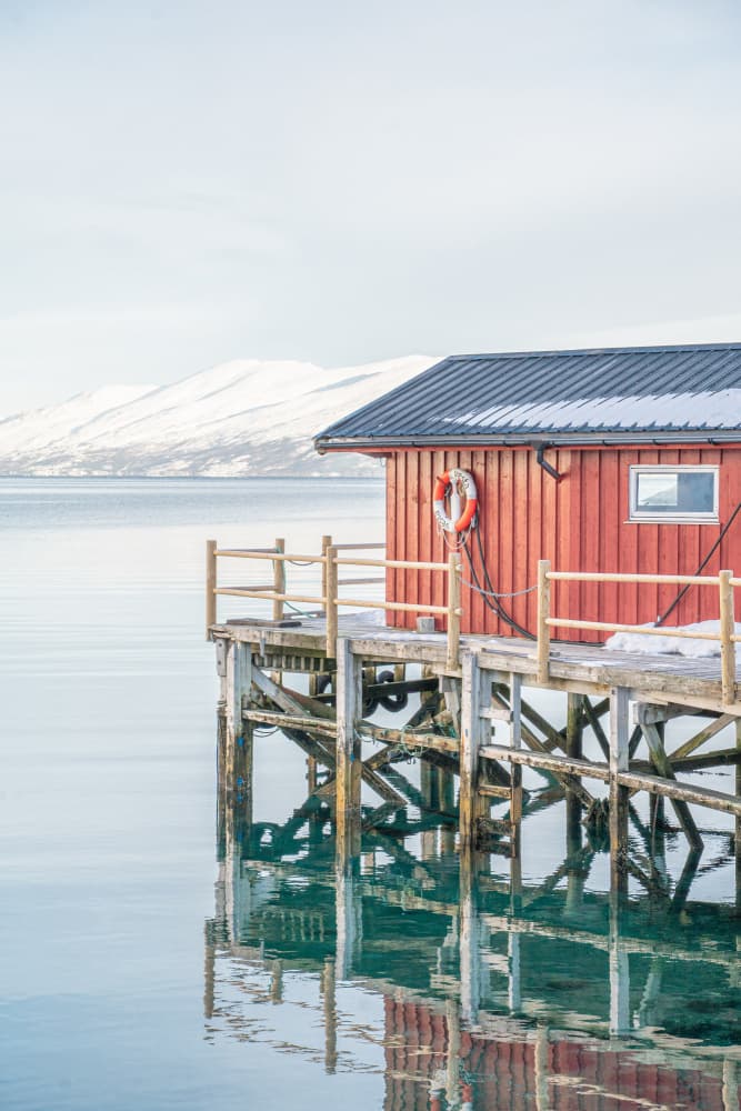 Red Cabin Winter Reflection by Henrike Schenk — canvas wall art