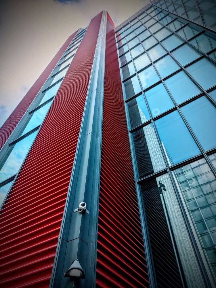 Red Skyscraper Upward View by Elizabeth Allen — canvas wall art