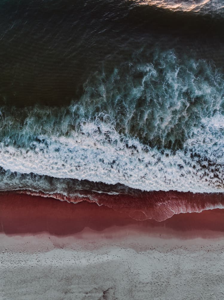 Red Sand Beach Waves by Javier Pardina — canvas wall art