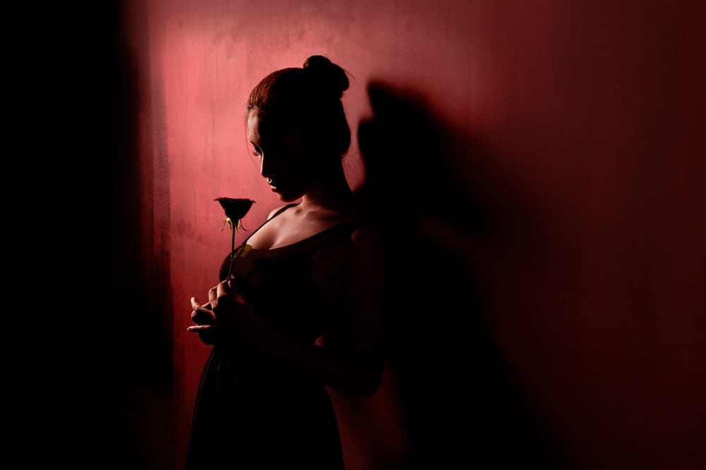 Woman With Red Rose by Sebastian Kisworo — canvas wall art