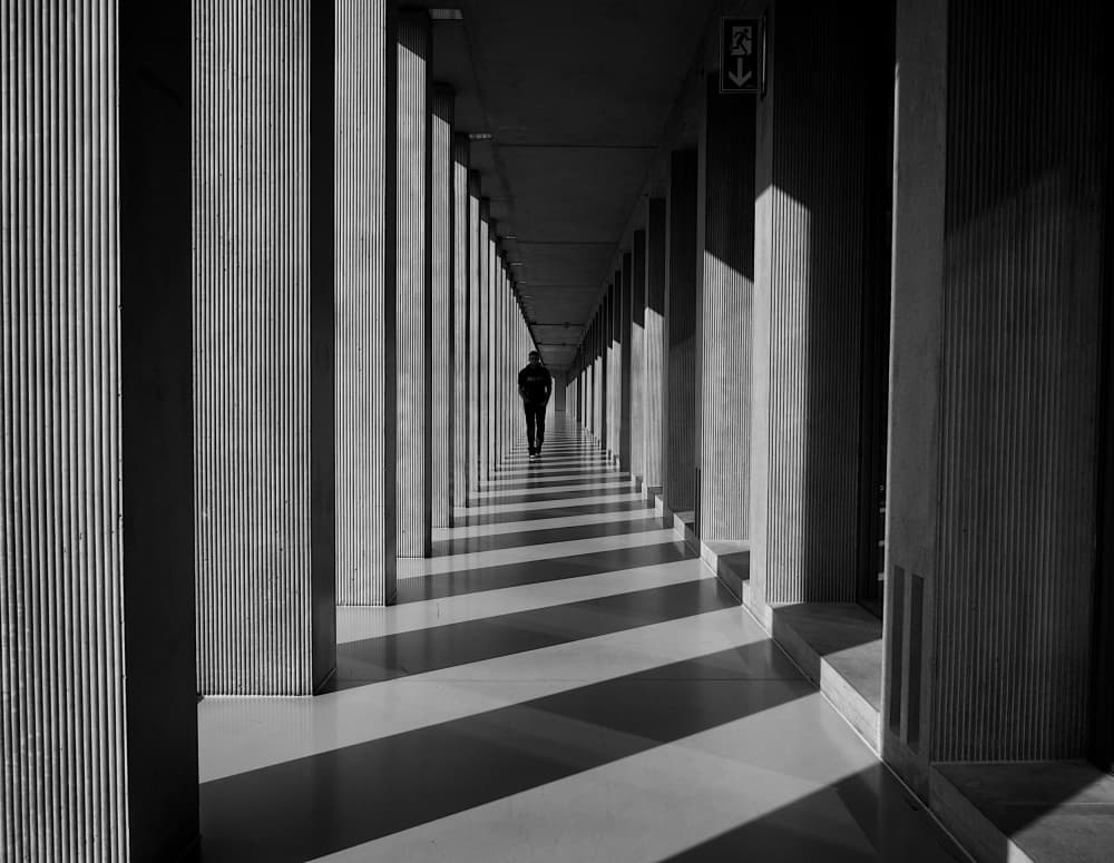 Shadowed Hallway Walk by Magdalena Roeseler — canvas wall art