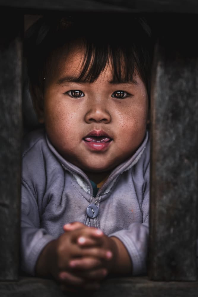 Curious Child Portrait by Marco Tagliarino — canvas wall art