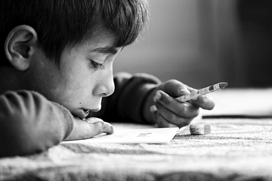 Focused Boy Drawing by Ileana Bosogea-Tudor — canvas wall art