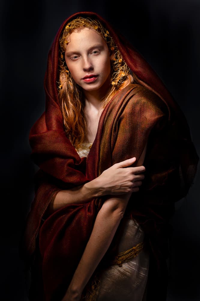 Pensive Woman in Red by Joan Gil Raga — canvas wall art