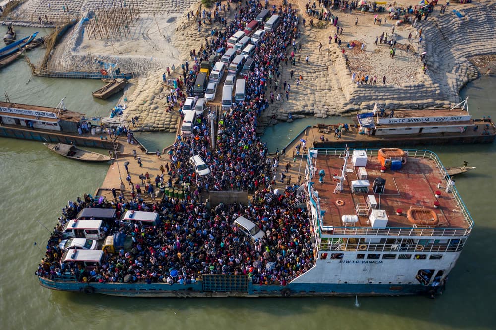 Crowded River Crossing by Azim Khan Ronnie — canvas wall art
